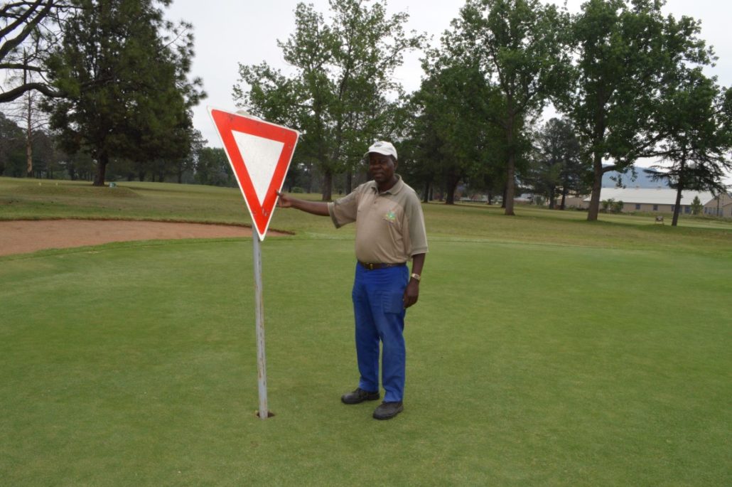 Golf Club And Street Signs Targeted 