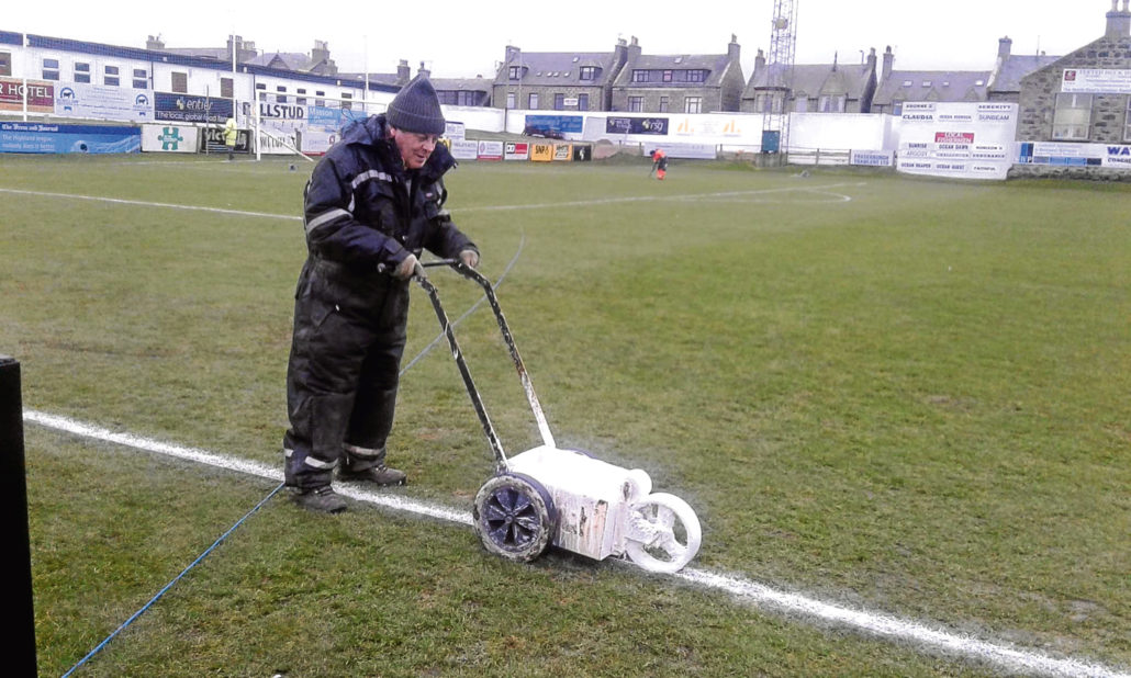 Volunteers Assist Match Preparation