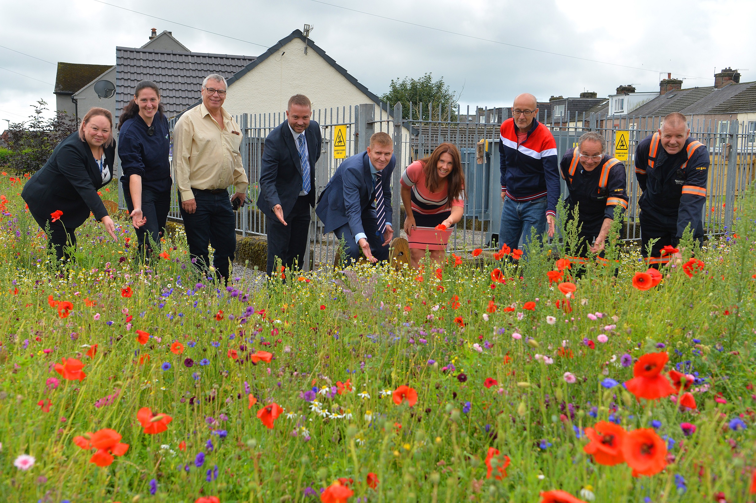 Celebrating Electricity North West’s ‘Transforming our Spaces’ project at the Smithfields substation in Egremont, including Angie Thornton, Electricity North West’s Groundworks Delivery Manager (far left) and Top Green’s Euroflor consultant Howard Wood (third left)