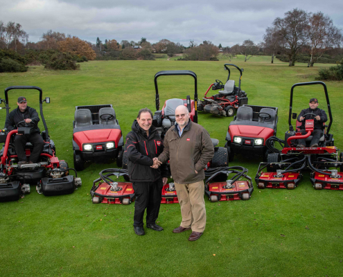 Rushmere Golf Club’s secretary manager Bob Tawell, centre left, shakes hands with Reesink’s Julian Copping and is joined by greenkeepers Michael Buck, left, and David Driver.